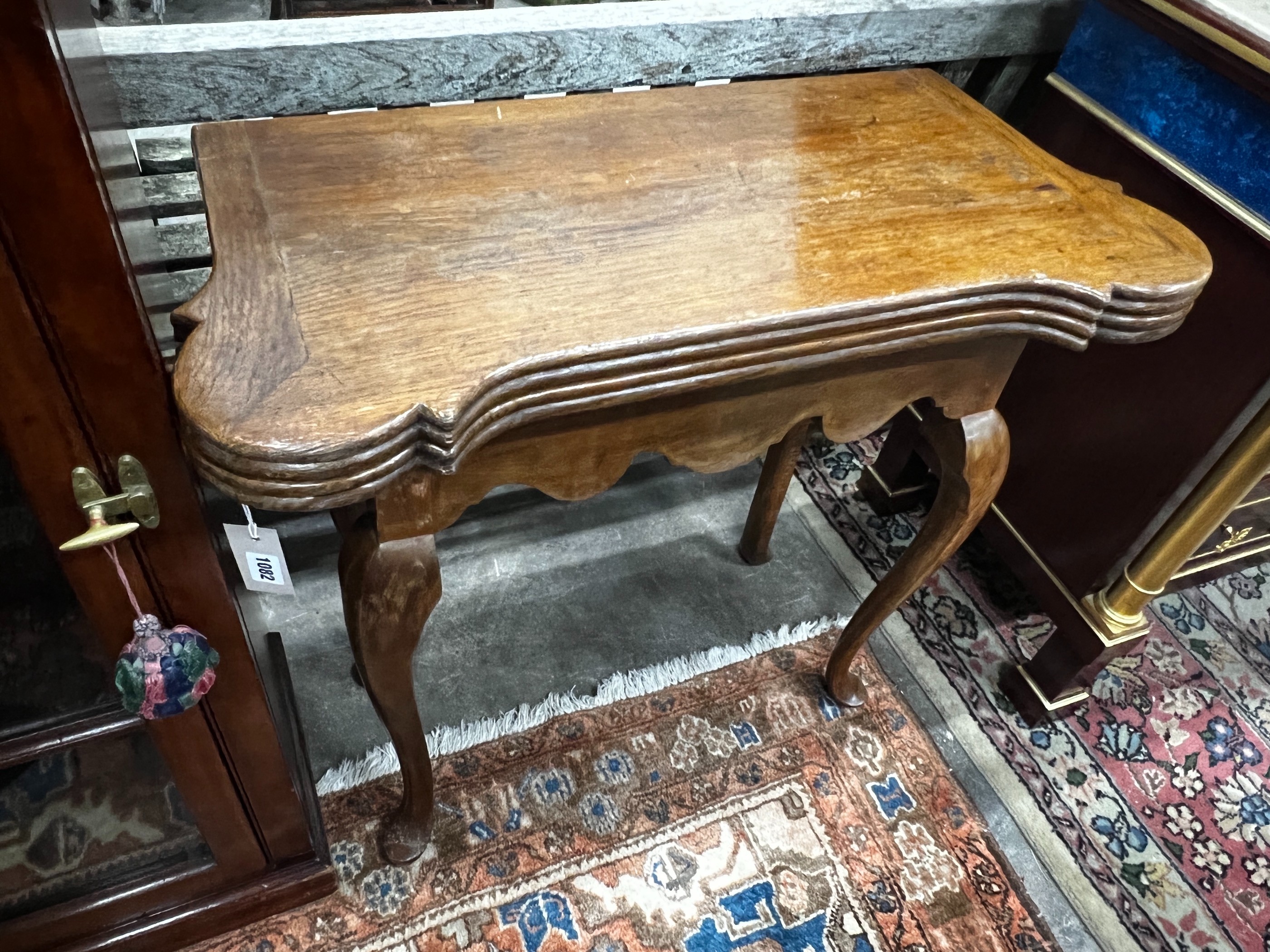 An 18th century style oak folding card table, width 82cm, depth 40cm, height 76cm